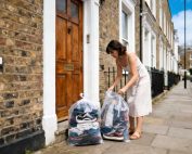 Woman donating clothes in London